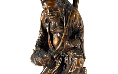 A JAPANESE MEIJI PERIOD CARVED WOODEN FIGURE OF THE...