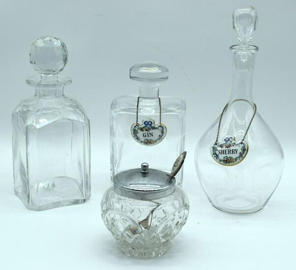 A Kosta Boda glass decanter together with two other