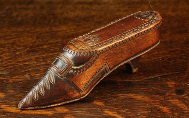 A Late 19th Century Carved Treen Snuff Box in the form of a lady's shoe, with chip carved vamp, a bu