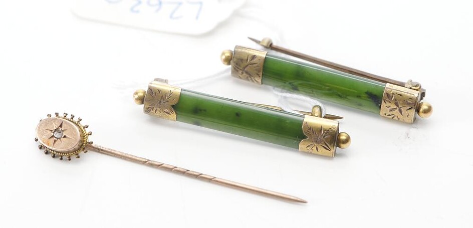 A PAIR OF ANTIQUE NEPHRITE BROOCHES, TOGETHER WITH A DIAMOND SET STICK PIN IN 9CT GOLD