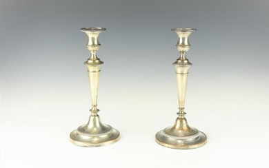 A PAIR OF ANTIQUE SHRFFIELD CANDLE HOLDERS