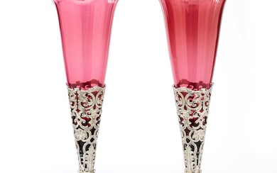 A PAIR OF VICTORIAN ELECTROPLATE VASE STANDS WITH CRANBERRY GLASS LINERS, PROBABLY PRYOR, TYZACK & CO., SHEFFIELD, CIRCA 1860