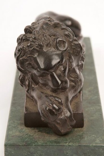 A Pair of Early Bronze Lions on Marble Plinths