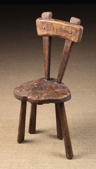 A Primitive French Rustic Chair. The back with cross rail nailed to two splayed uprights tapering do