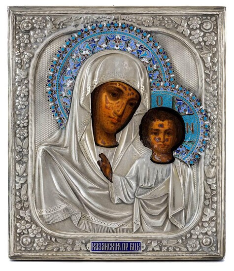 A Russian icon of the Mother of God of Kazan, 19th century, unknown maker, Cyrillic S.G. to oklad, possibly St Petersburg, Christ raising his hand in benediction and the Mother of God leaning towards him, on wood panel with silver oklad with...