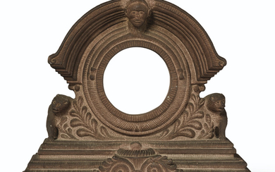 A SANDSTONE CLOCK HOLDER DEPICTING A FACE AND ANIMALS, PROBABLY AMERICAN, 19TH/ 20TH CENTURY