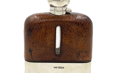 A SILVER TOPPED AND LEATHER CASED GLASS HIP FLASK,...