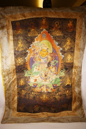 A Sino-Tibetan printed thangka depicting a wrathful deity en...