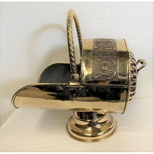 A VICTORIAN BRASS HELMET SHAPED COAL SCUTTLE, with rope desi...