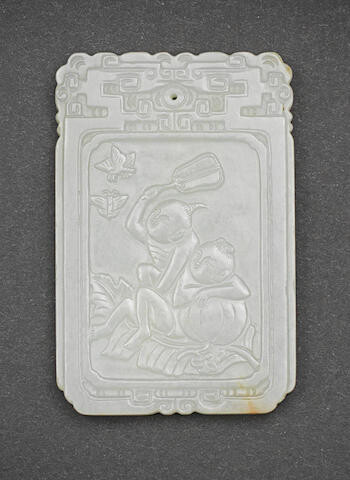 A WHITE JADE 'BOYS AND BUTTERFLIES' PLAQUE