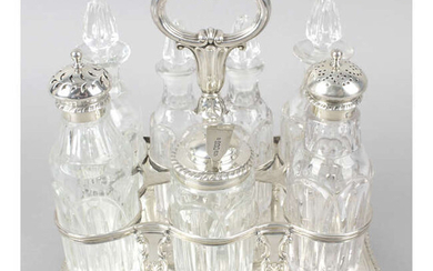 A William IV seven bottle silver cruet stand.