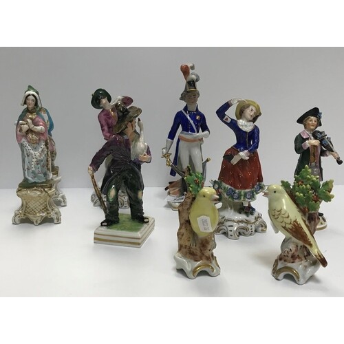 A collection of Continental porcelain figures including a pa...
