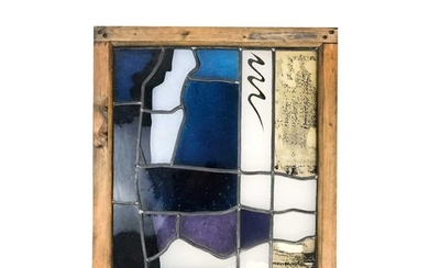 A contemporary abstract stained glass panel. In shades of bl...