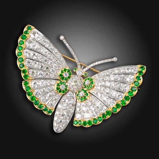 A demantoid garnet and diamond butterfly brooch, pave-set with graduated...