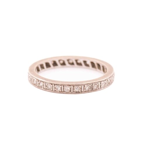 A diamond eternity ring, fully pavé-set with round single-cu...