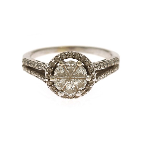 A diamond ring set with numerous fancy- and brilliant-cut diamonds, mounted in 14k white gold. Size 48.5.