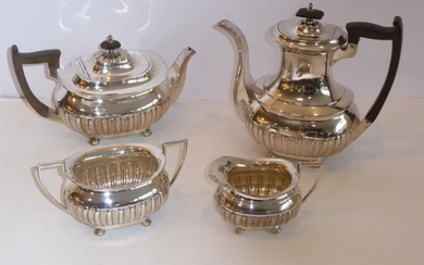 A four-piece hallmarked silver tea and coffee service in...