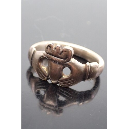 A gold Georgian Claddagh ring, with a Victorian shank finger...