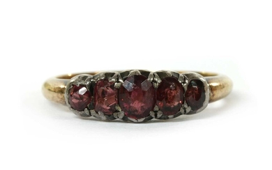 A gold and silver garnet ring