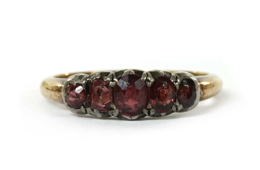 A gold and silver garnet ring