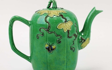 A green glazed melon or gourd-shaped teapot with relief decoration
