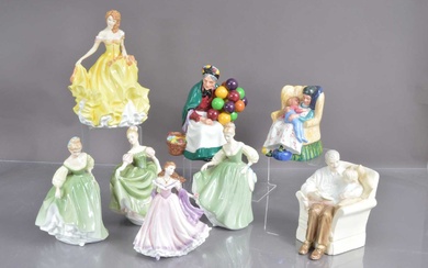 A group of eight Royal Doulton and Wedwood figurines