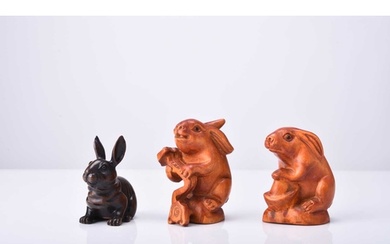 A group of three Japanese carved wood netsuke of rabbits, 20...