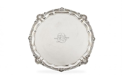 A large Edwardian silver shaped circular salver by Harrison Brothers & Howson