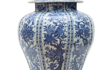 A large Kangxi blue and white covered vase on wooden stand