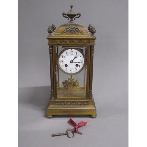 A late 19c French four glass clock, the gilt base having a c...