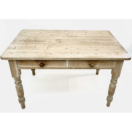 A late Victorian pine kitchen table, fitted with two drawers...