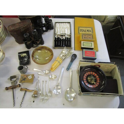 A mixed lot of games, flatware, binoculars and other items t...