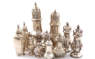 A mixed lot of silver condiments, various dates and makers, comprising: a sugar caster by Walker and Hall, Sheffield 1910, octagonal baluster form, another sugar caster, two pairs of pepper pots, two single peppers, a salt pot and a pair of modern...