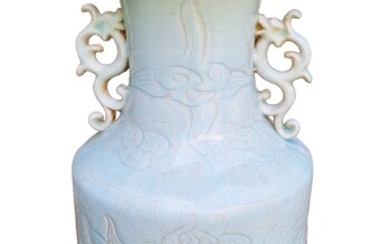 A modern Chinese Qingbai glazed vase with incised dragon