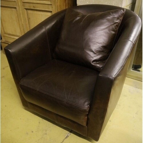 A modern brown leather swivel armchair