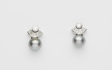 A pair of 18k gold diamond and cultured Tahiti pearl stud earrings.