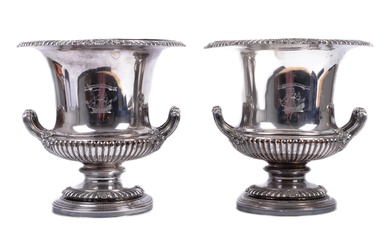 A pair of 19th century Old Sheffield silver plated wine coolers in the form of urns. Each with central etched logo of a tall sailing ship with Latin inscription for Tutus in Undus - Safe on the Waves - Twin handled with acanthus moulded circular...