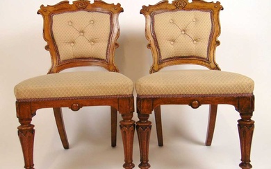 A pair of 19th century oak dining chairs upholstered in...