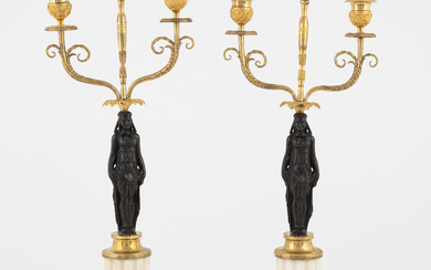 A pair of French Louis XVI two-light marble and ormolu candelabra, late 18th century.
