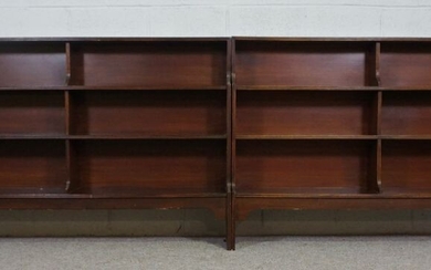 A pair of George III style mahogany waterfall open bookcases, 20th century, each with three