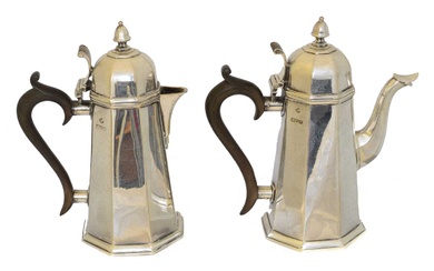 A pair of George V silver coffee pots