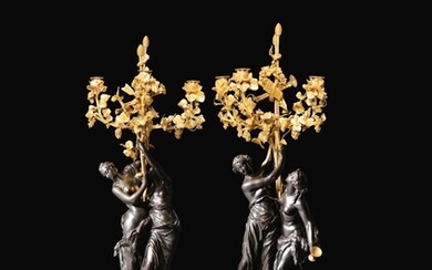 A pair of Louis XVI patinated gilt-bronze candelabra, circa 1785 | Paire de grands candélabres en bronze patiné et doré d'époque Louis XVI, vers 1785