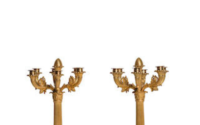 A pair of early 19th century gilt bronze five light candelabra