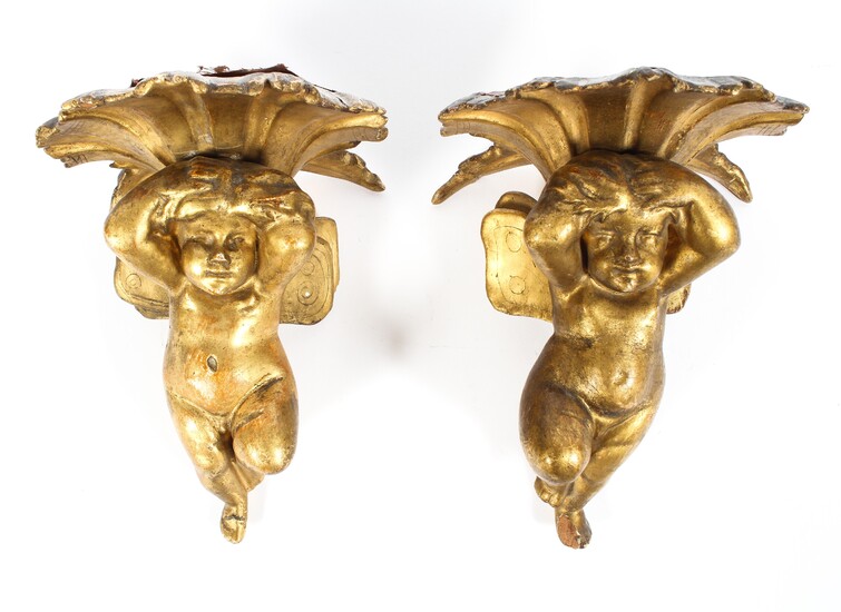 A pair of giltwood cherub wall sconces, early 20th century
