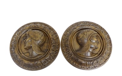 A pair of late 19th / early 20thC carved walnut roundels dep...