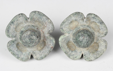 A pair of pre-Columbian Mayan style pale green hardstone waterlily ear spools, probably 250-550 AD
