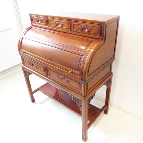 A reproduction Chinese hardwood cylinder bureau in 19th cent...