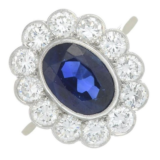 A sapphire and diamond cluster ring. Sapphire