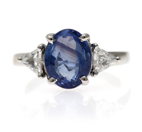NOT SOLD. A sapphire and diamond ring set with an oval-cut sapphire weighing app. 3.65 ct. flanked by two diamonds, mounted in 14k white gold. Size app. 52. – Bruun Rasmussen Auctioneers of Fine Art