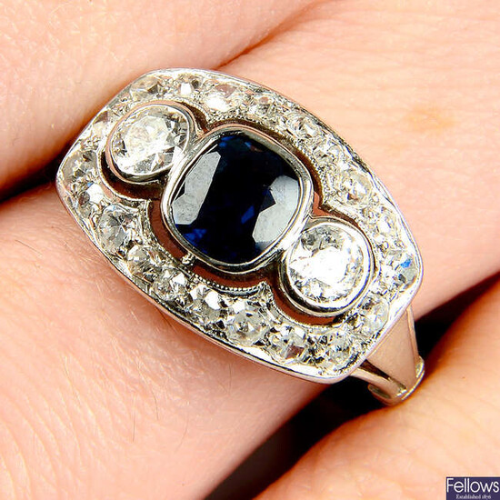 A sapphire, circular and single-cut diamond dress ring.